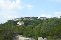 houses on the hill behind Mt Bonnell